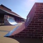 Large quarter pipe skateboard ramps, hand painted for boarder cross course.