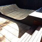 2ft (60cm) high mini ramp half pipe custom platform cut into existing stairs in backyard