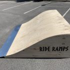 60cm high rolled flat bank (hump) skateboard ramp in raw timber in a car park