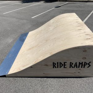 60cm high rolled flat bank (hump) skateboard ramp in raw timber in a car park