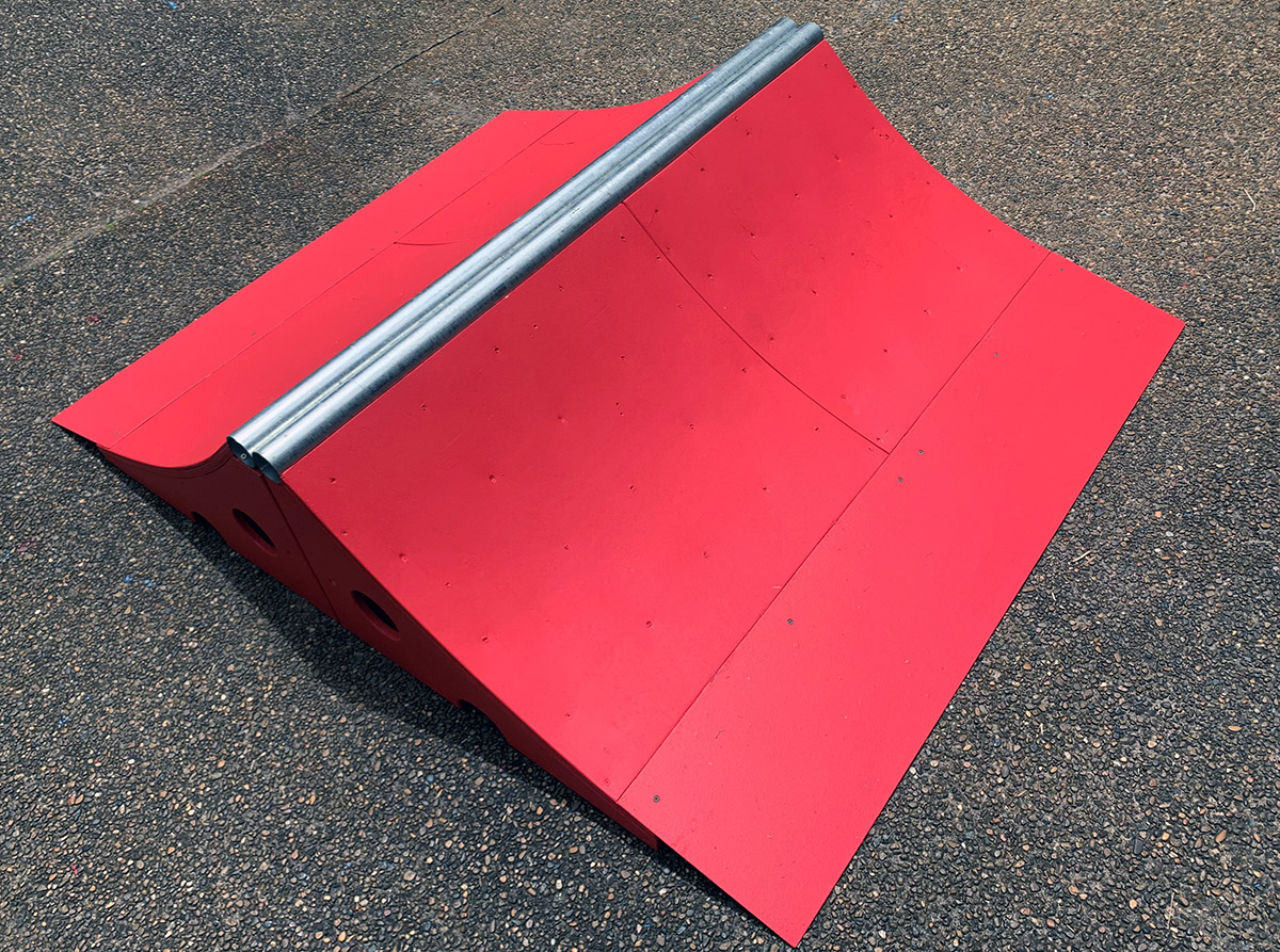 45cm high x 150cm wide spine skateboard ramp in red