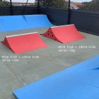 45cm high and 60cm high spines ramps in red in a pop up skate park.