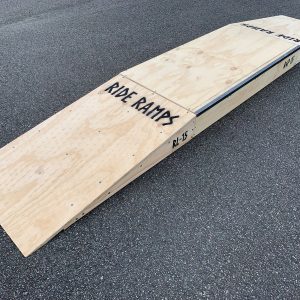 15cm high double launch ramp (wedge skateboard ramp) - grind pad (manual pad-grind box) combo in raw timber, diagonal view.