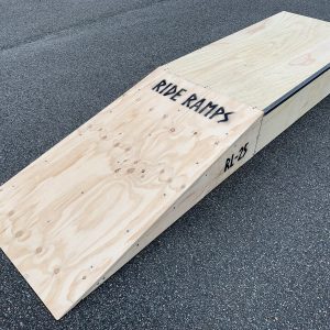 25cm high launch ramp - grind pad combo (wedge skateboard ramp plus manual pad-grind box) diagonal view