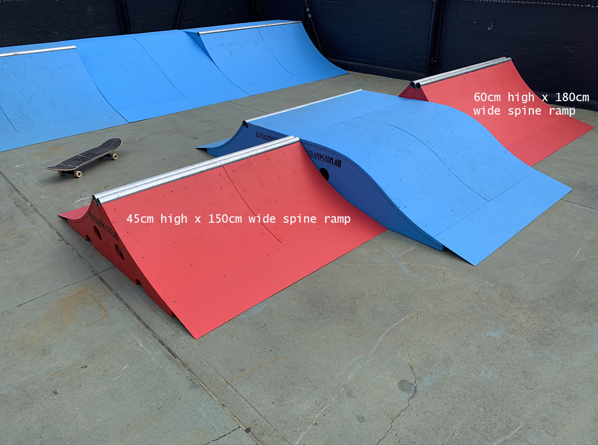 45cm high and 60cm high spine ramps in red, in a pop up skate park.